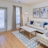 living room with a couch, chair, and coffee table