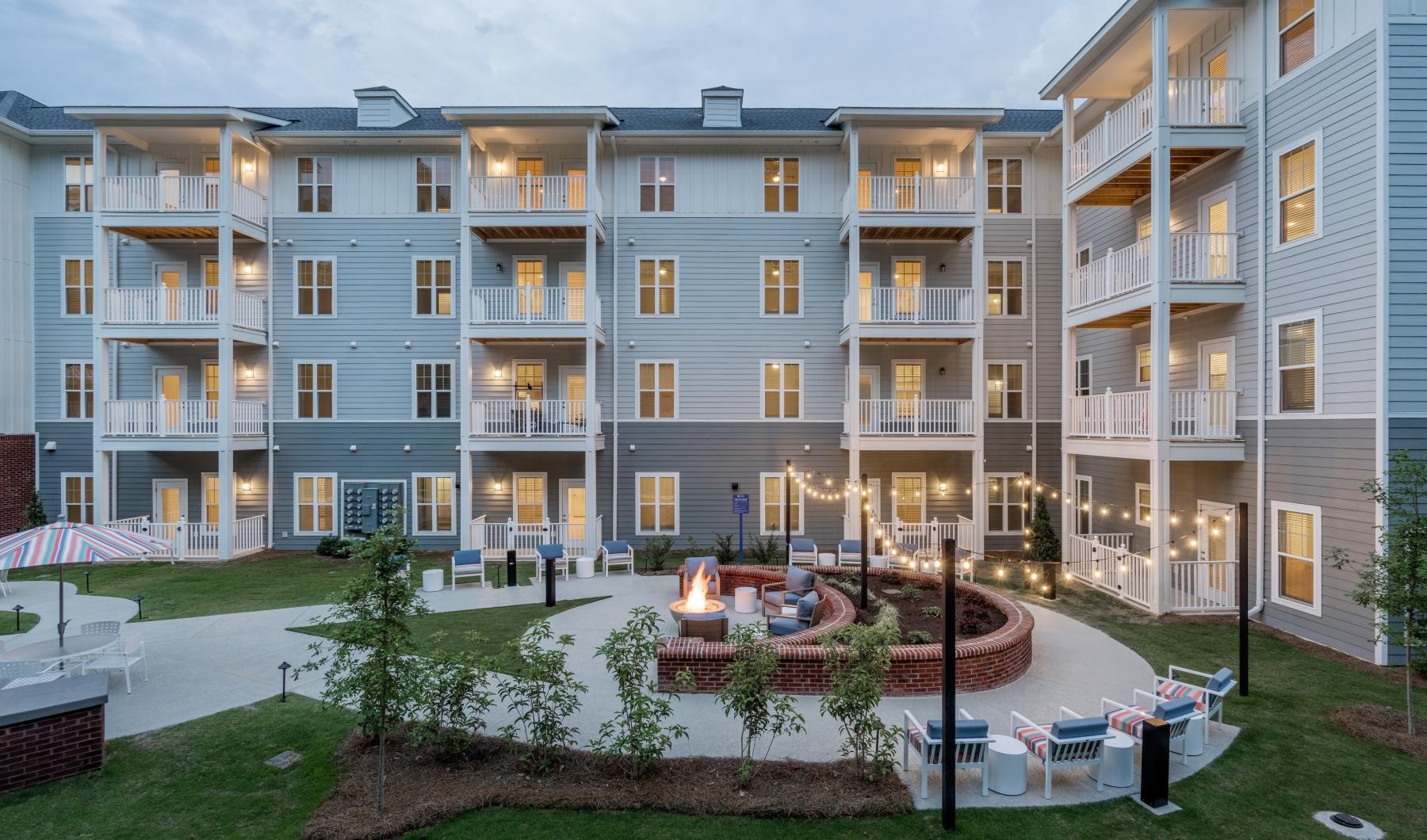 a multi-story building with a courtyard