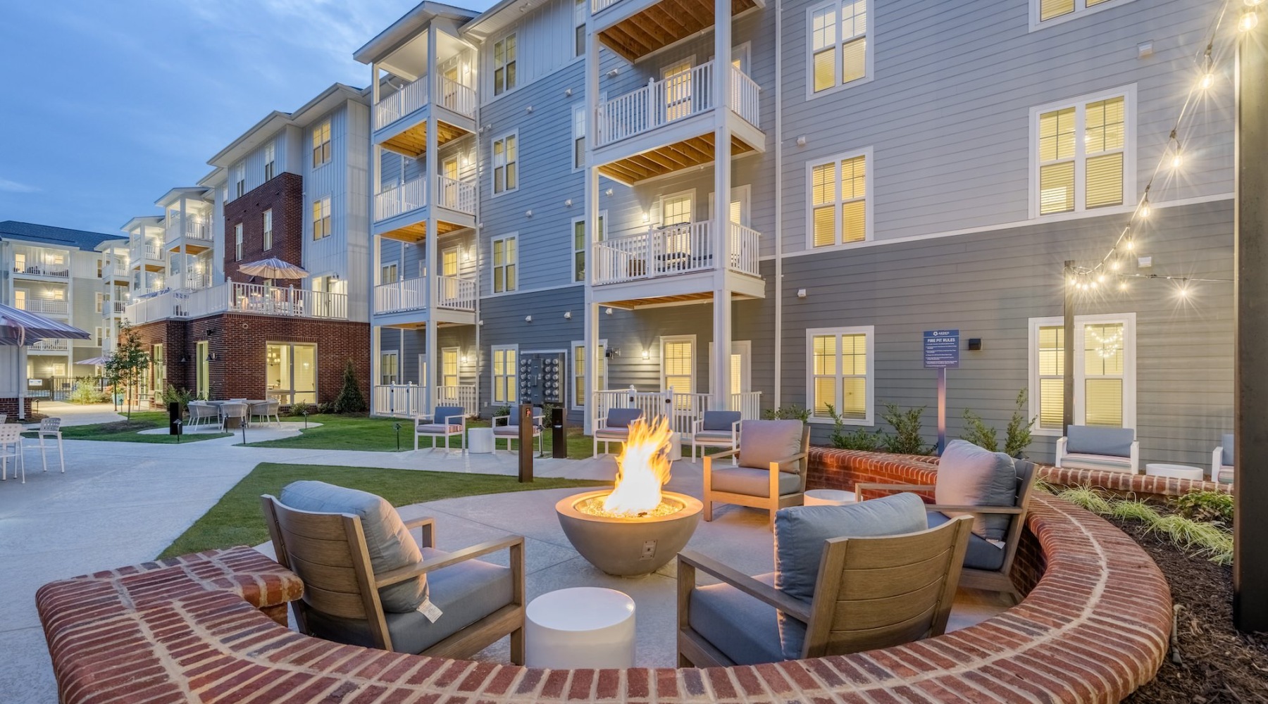 Everything within reach a firepit with chairs around it in a courtyard