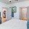 a bedroom with a large bed and tv