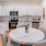 a kitchen with white cabinets