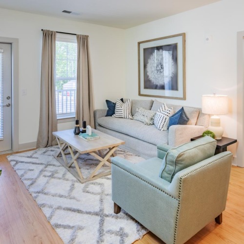 Gorgeous natural light in your living space a living room with a couch and a coffee table