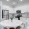 Model kitchen at Arden at Indian Land Apartments in South Carolina, featuring stainless steel appliances and a dining table.
