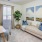 Model office at Arden at Indian Land Apartments in South Carolina, featuring carpeted flooring and a desk.