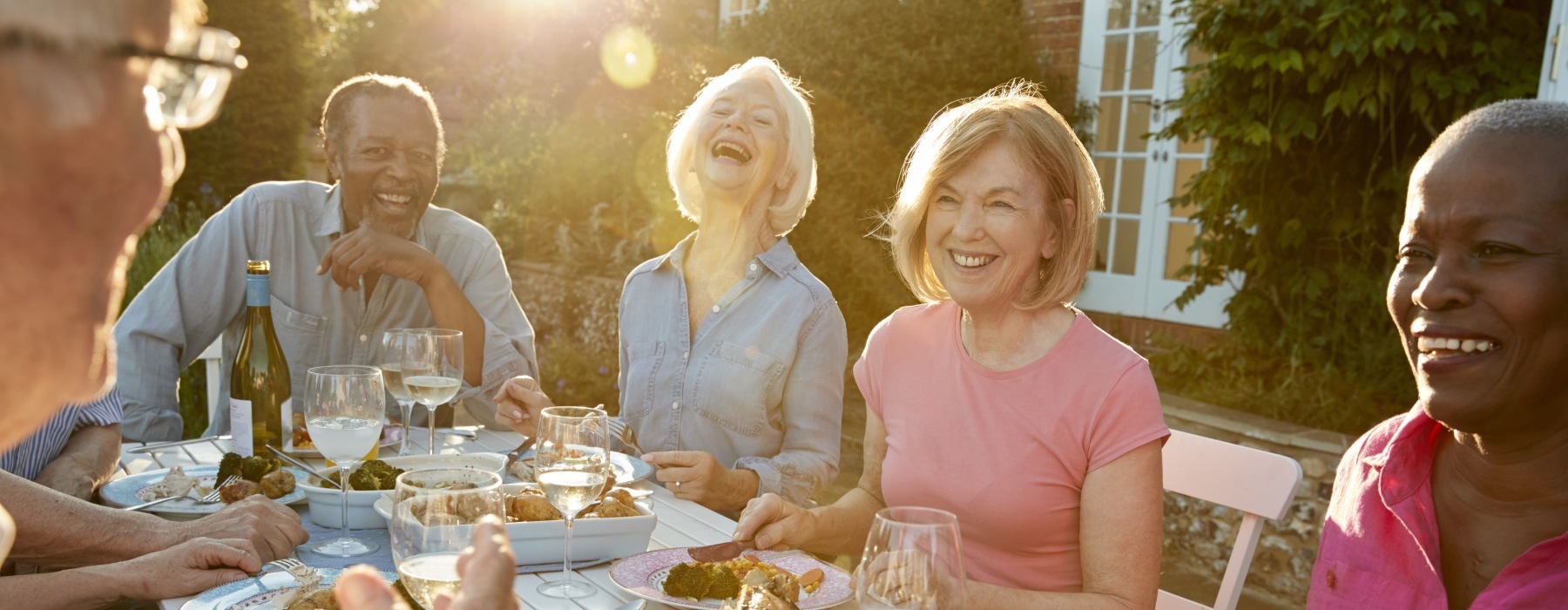 a group of friends laughing outdoors