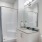 a bathroom with a tub sink and a shower